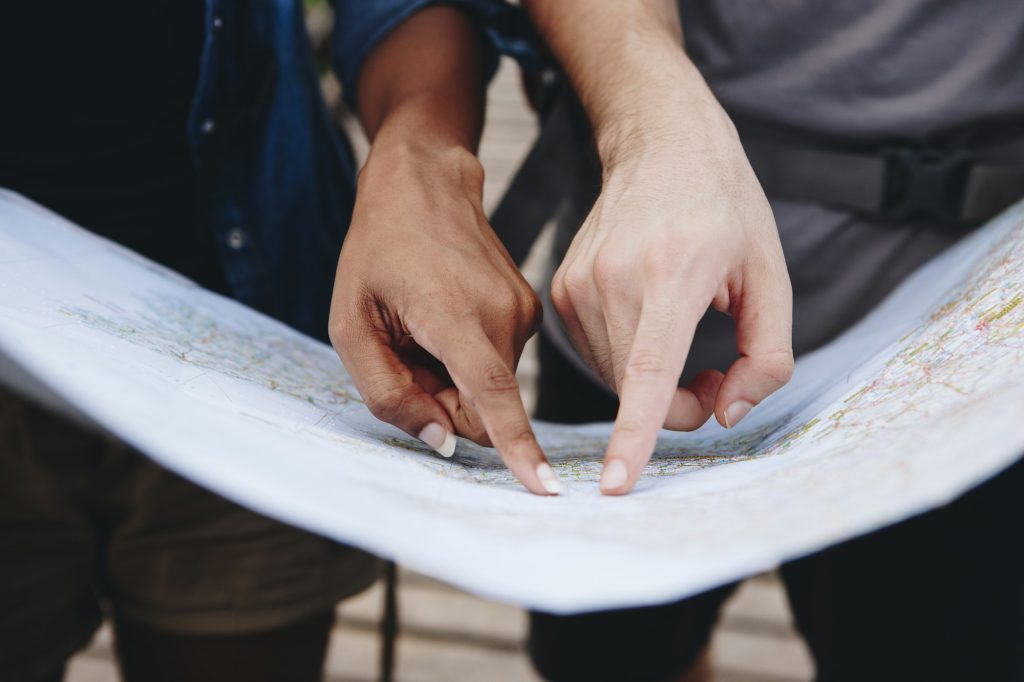 Friends finding directions with a map